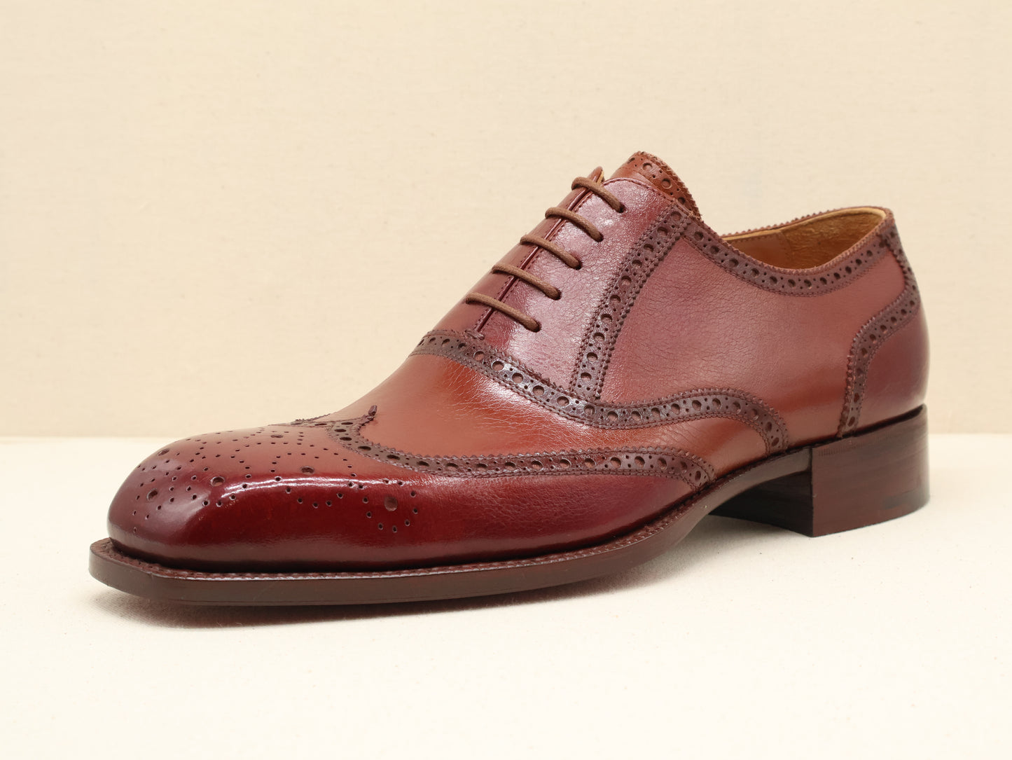 Bespoke Full Brogue Oxford with Chisel Toe, handcrafted from fine English box calf leather in a deep burgundy patina. Featuring traditional wingtip brogue detailing, a sculpted French chisel toe, and a Goodyear-welted leather sole by euGo, The Art of Shoemaking, Burlingame, California.