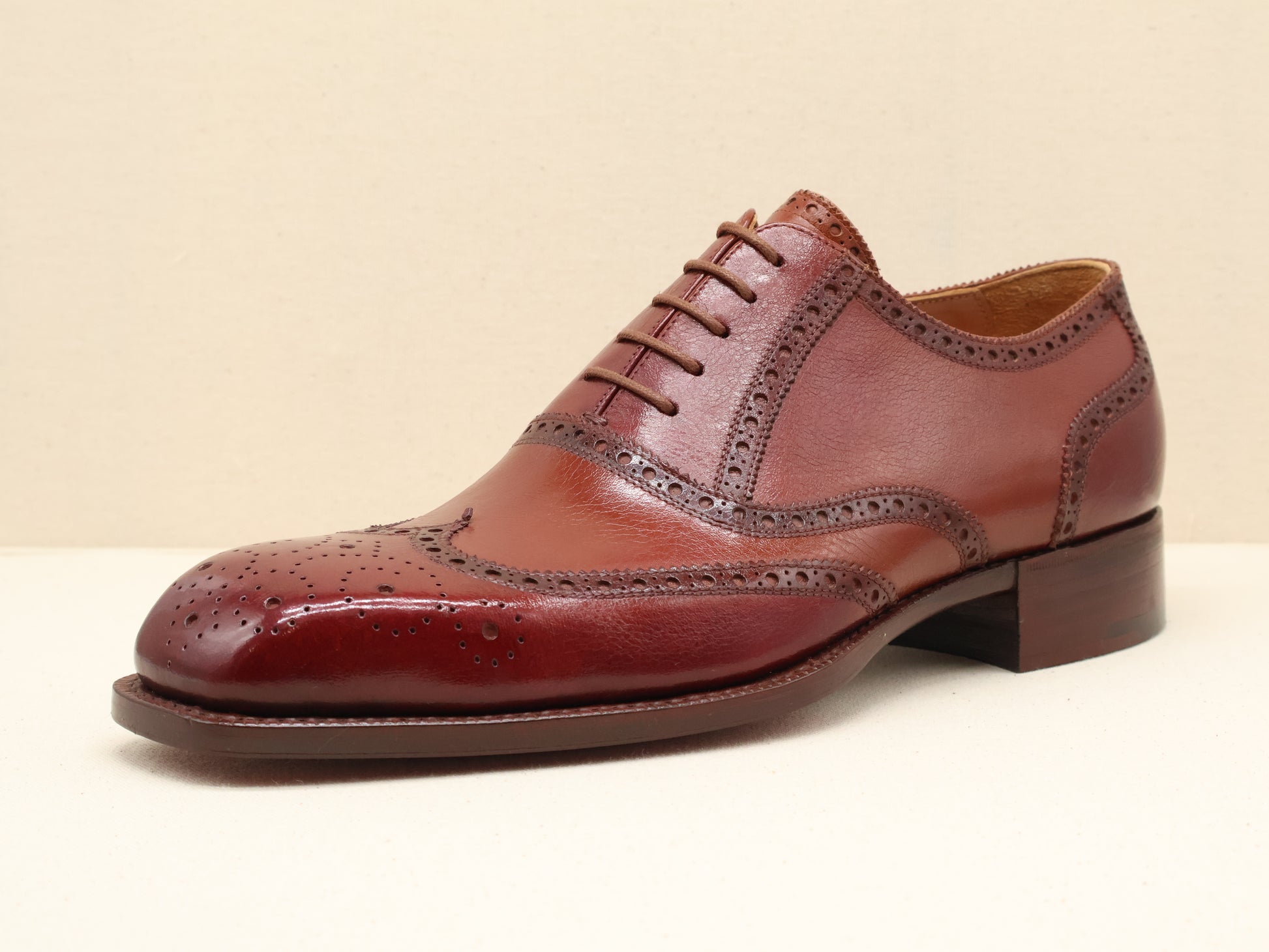 Bespoke Full Brogue Oxford with Chisel Toe, handcrafted from fine English box calf leather in a deep burgundy patina. Featuring traditional wingtip brogue detailing, a sculpted French chisel toe, and a Goodyear-welted leather sole by euGo, The Art of Shoemaking, Burlingame, California.