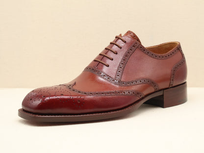 Bespoke Full Brogue Oxford with Chisel Toe, handcrafted from fine English box calf leather in a deep burgundy patina. Featuring traditional wingtip brogue detailing, a sculpted French chisel toe, and a Goodyear-welted leather sole by euGo, The Art of Shoemaking, Burlingame, California.