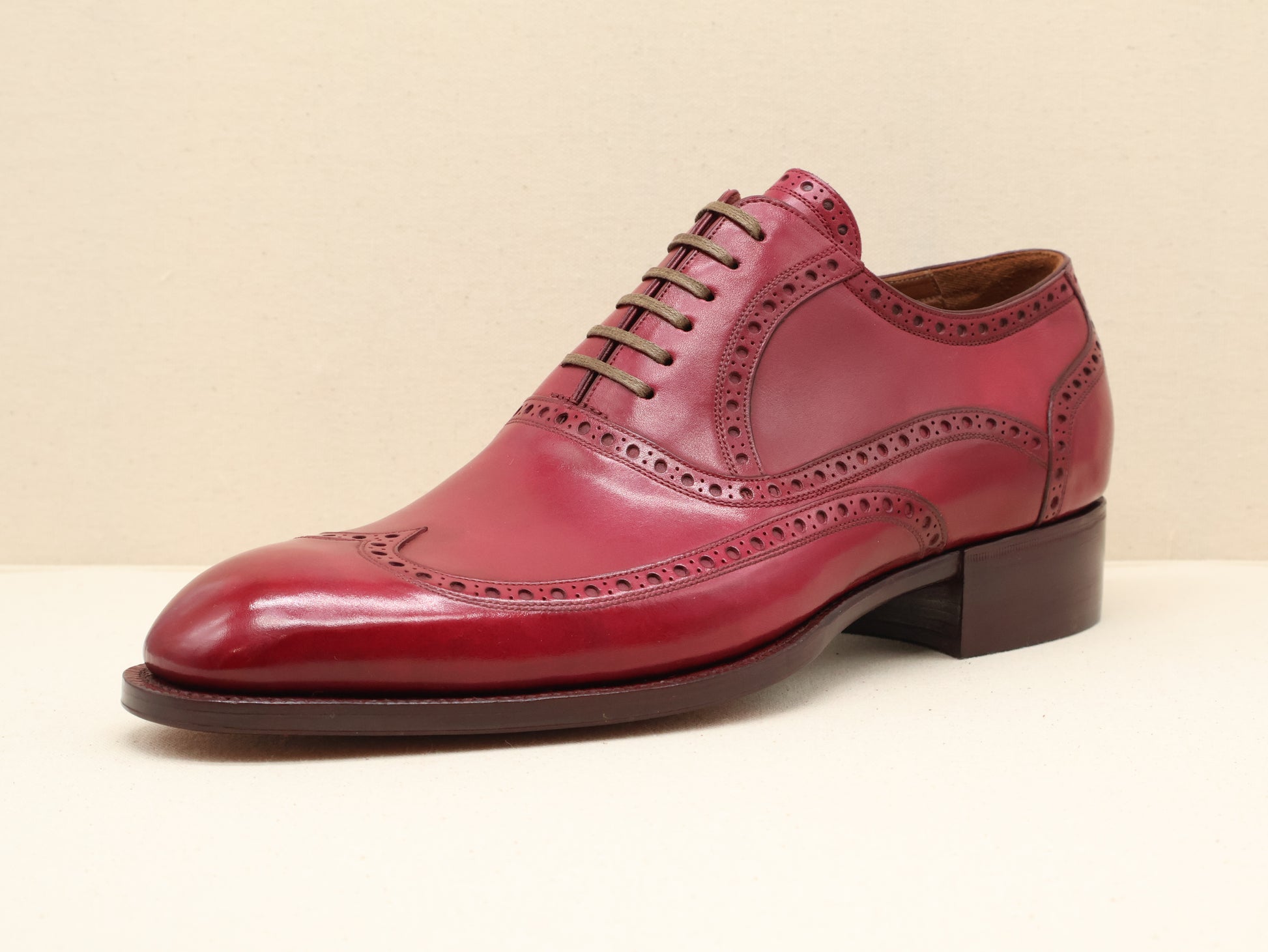 Custom-made long wingtip semi-brogue Oxford crafted from French box calf leather with a hand-finished veg-tanned leather sole, by euGo, The Art of Shoemaking in Burlingame, California.