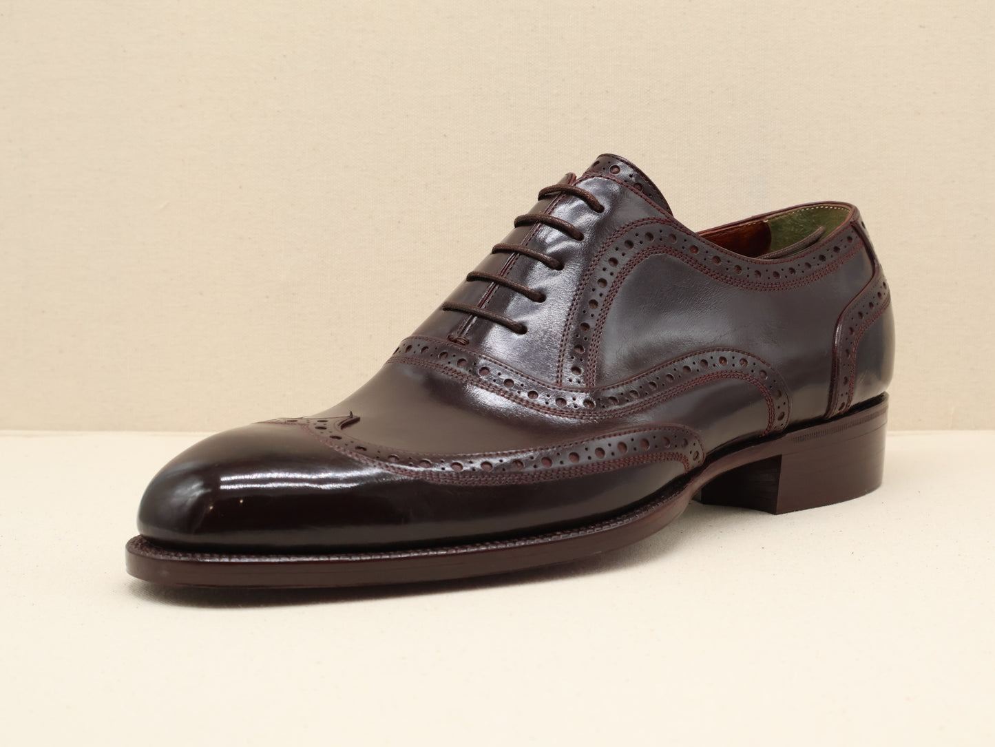 Bespoke Classic English Wingtip Oxford, crafted from dark brown German box calf leather with a mirror-polished finish and hand-stitched veg-tanned sole by euGo, The Art of Shoemaking, Burlingame, California.