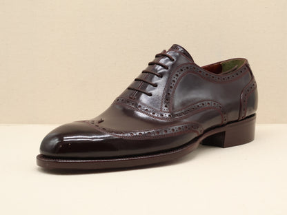 Bespoke Classic English Wingtip Oxford, crafted from dark brown German box calf leather with a mirror-polished finish and hand-stitched veg-tanned sole by euGo, The Art of Shoemaking, Burlingame, California.